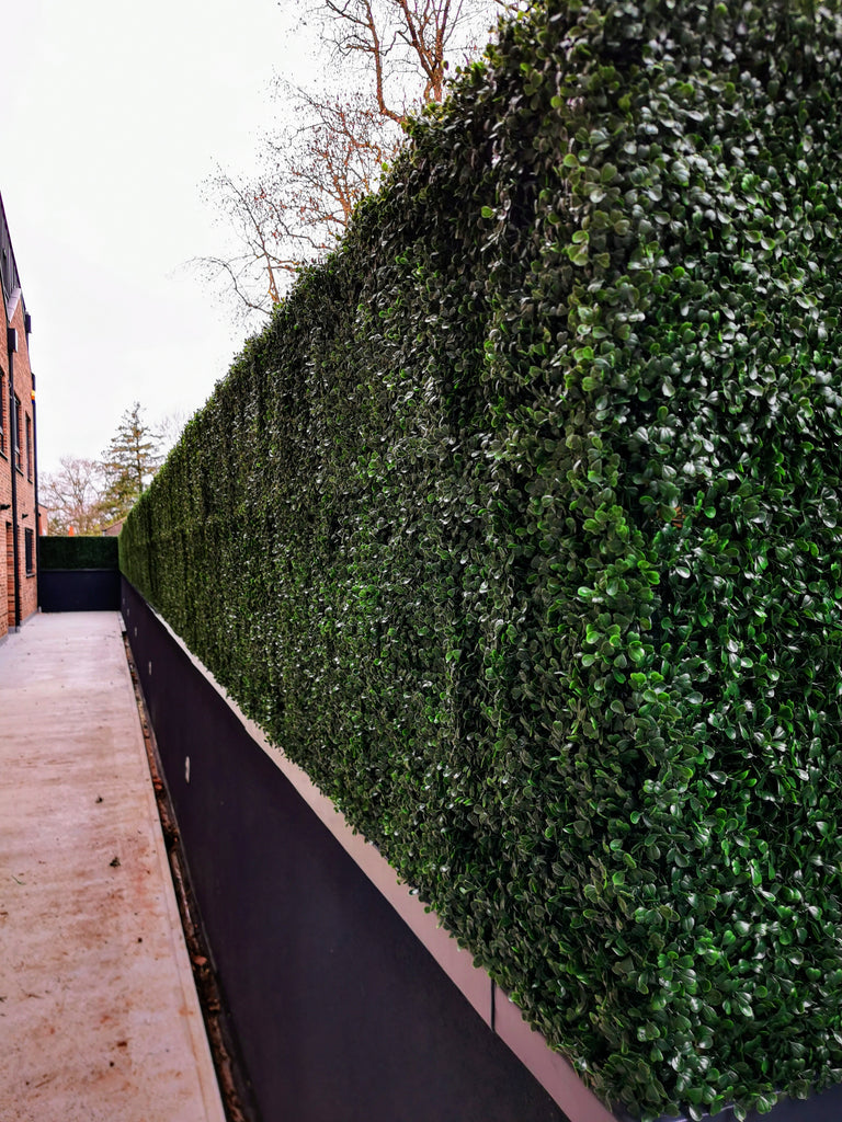 Hide the eyesore with an artificial hedge screen